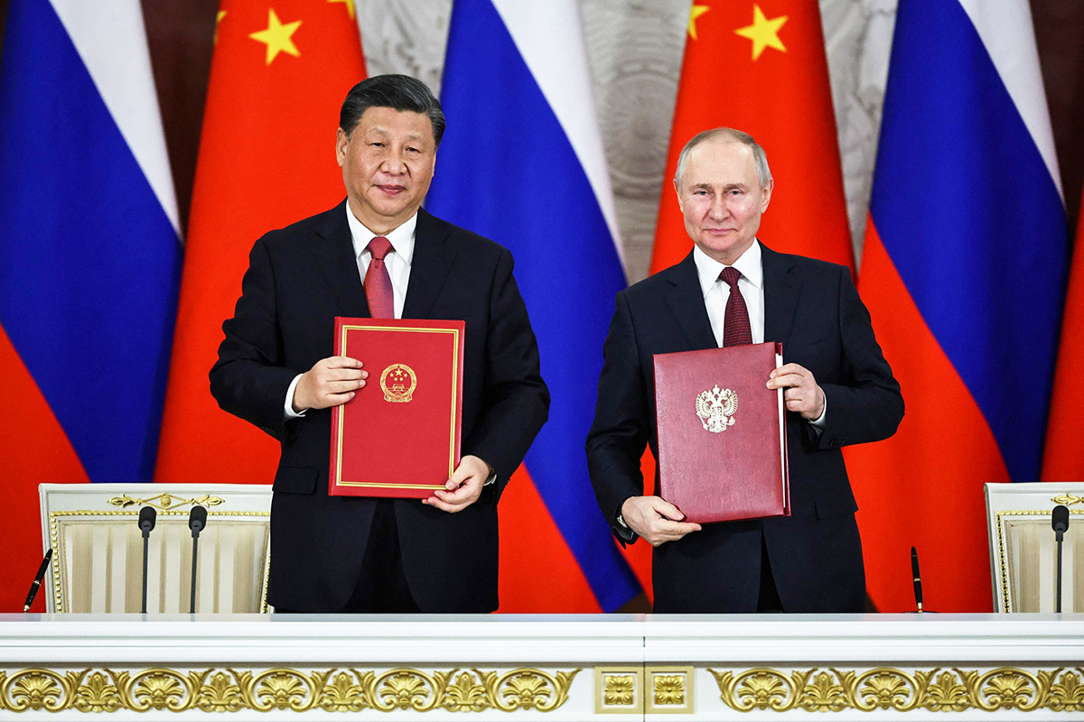 14 văn kiện đã được ký kết nhằm mở rộng hợp tác trên tất cả các lĩnh vực kinh tế, thương mại, công nghiệp, khoa học và quân sự giữa Nga và Trung Quốc. Ảnh: AFP